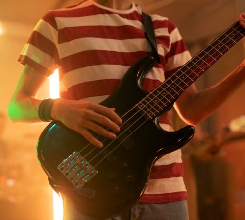 young-man-playing-guitar-music-local-event_23-2149188121